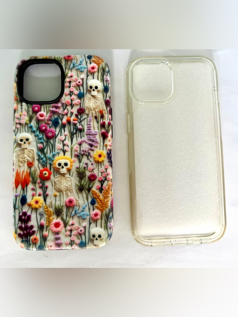 iPhone 15 Phone Cases Lot of 2 Silicone Cases Gently Used Skeleton/Flowers Clear